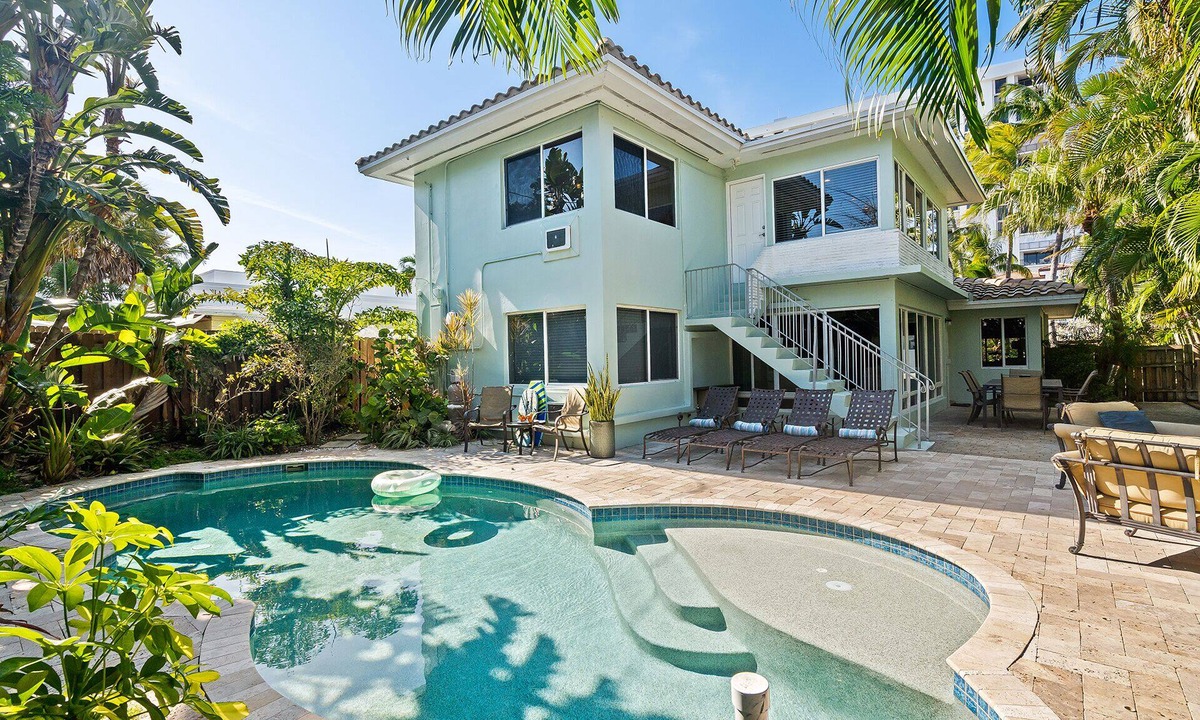 Birch Park Finger Streets House | Beautiful Beach House with pool, lush tropical landscaping steps from the ocean