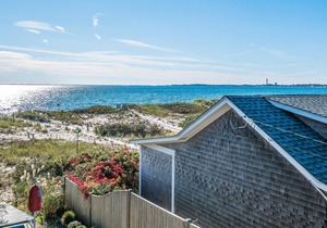 Oceanfront escape with full kitchen, bay-view balcony, AC & firepit