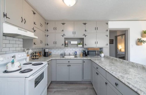 Covington House | 2 bedroom beauty with patio and yard, next to legion field