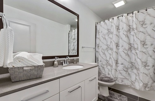North Buckhead Apartment | 2 minutes walk to lenox! Stylish high rise w/ fireplace!