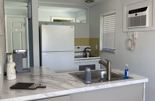 Holmes Beach Apartment | 3 Minute walk to beautiful AMI beach! Old Florida Charm with a Modern Flair!