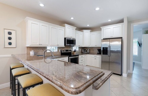 Holmes Beach House | Beach Breeze- 6 bedroom private pool/spa and one minute stroll to the beach