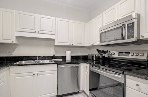 Vaught Condo | Beautiful condo with pool. 5 minute drive to beach. Sleeps 8. Pet friendly