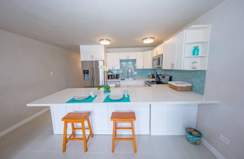 Kuau Condo | BEAUTIFUL NEW Beach-chic condo with AC 1 mile from Paia & Steps to Mama's Beach