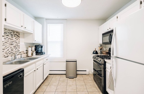 Summit - University House | Bright, chic & spacious by Summit/Hamline in St Paul with porch and swing chairs