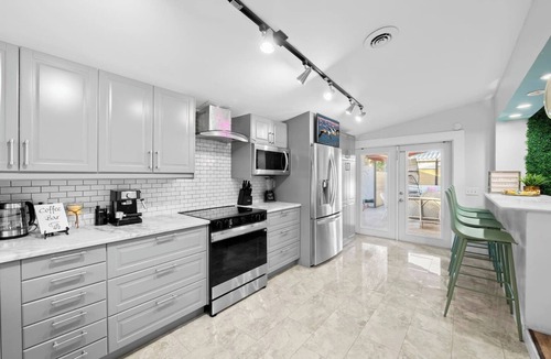 Poinsettia Heights Villa | Poinsettia Palms! Giant Heated Pool! Hot Tub, Fire Pit, PuttngGreen, N64, IceBath, Gym!