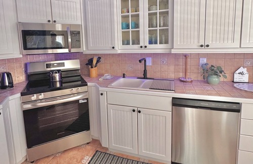 Harbor Village Condo | Relax & Unwind – Walk to the Beach from This 2BR -2BA with Pool and fishing dock