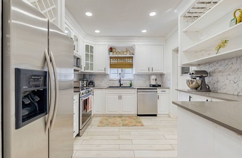 Santa Barbara Estates House | Tropical backyard oasis w/putting green, grill, tiki bar & walk to beach