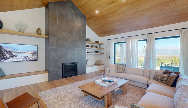 Modern home with a hot tub, game room and fabulous deck space!