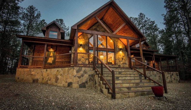 Soaring cathedral ceilings, gas rock fireplace, large hot tub, smart tv, games.