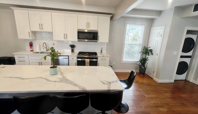 Spacious 4BDRM, Sleeps 15, in Boston with free parking, close to transportation.