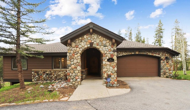 Stay at Evergreen Lodge, a secluded home with a private hot tub.