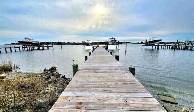 Two Waterfront homes with two private docks, two hot tubs, Seven bedrooms and 4 bathrooms with boat lift.